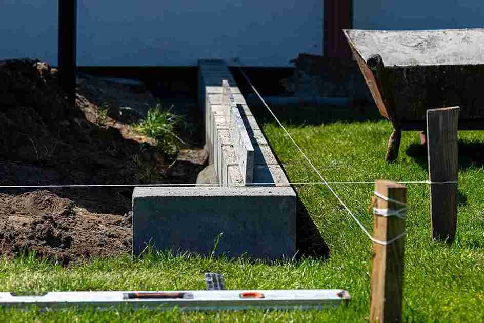“Concrete retaining wall with drainage installed on sloped yard in Brunswick OH
